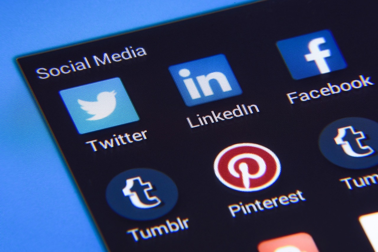 Smartphone showing social media apps on a desk