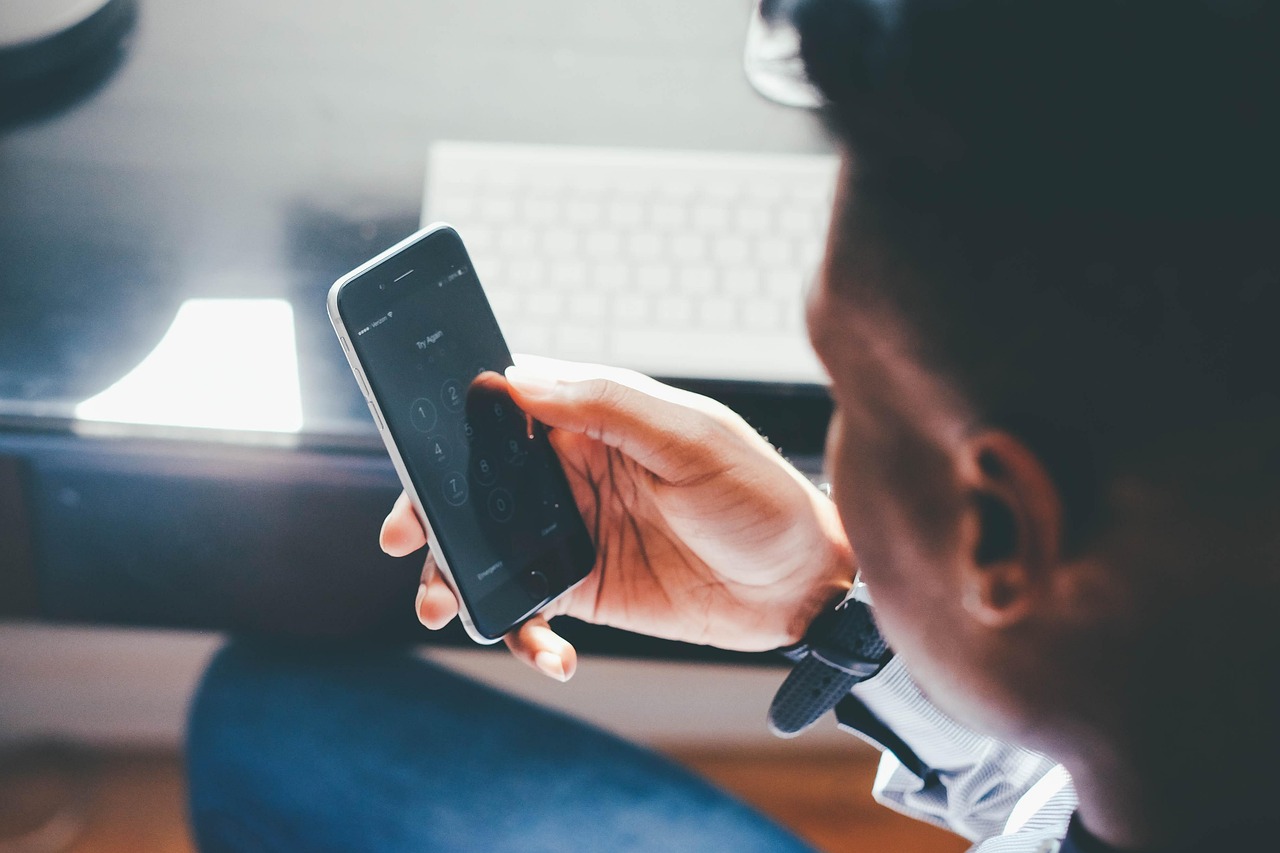 Marketer checking social media notifications on a smartphone