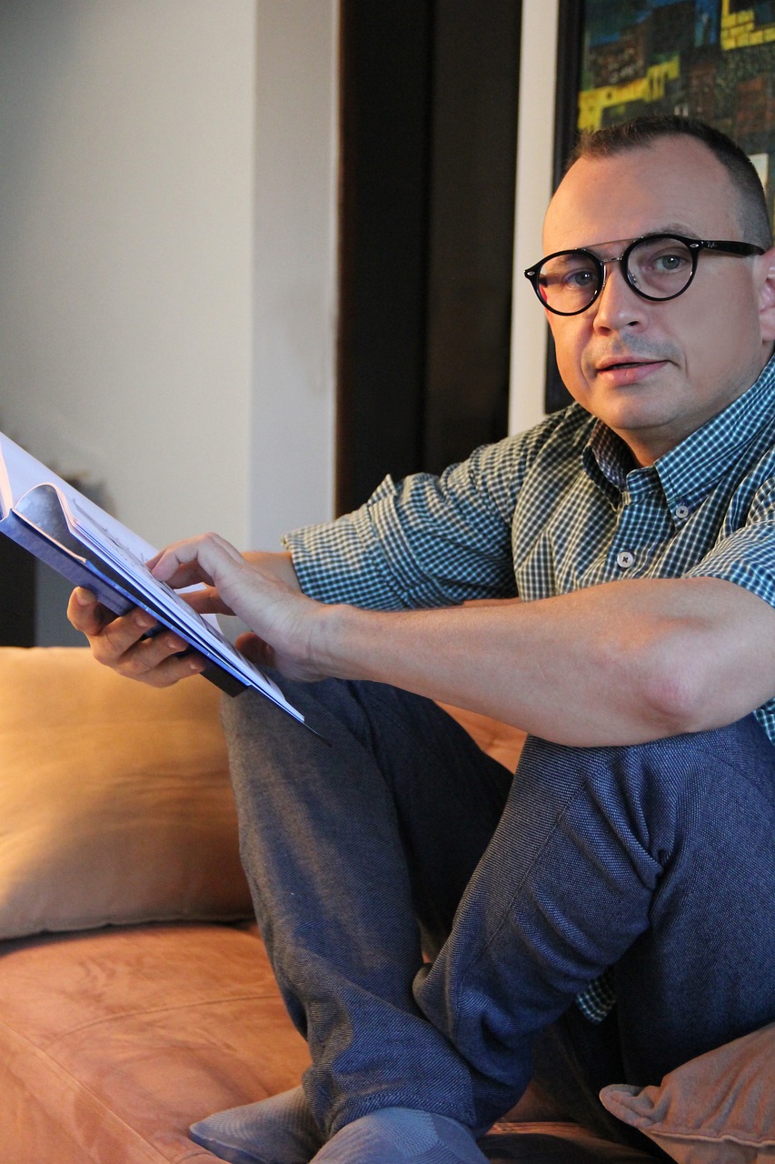 Writer reviewing a draft on a tablet in a bright room
